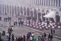 Venice Italy elevated day view of tourists on Saint Mark main square, around famous cafe bistro outdoor Royalty Free Stock Photo