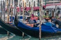 Venice, Italy. February 2020. Gondoliers in Venice prepare their typical Venetian gondolas for the day. Popular gondola rides with Royalty Free Stock Photo