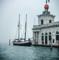 Historic building and a big Sailing boat at venice docks Royalty Free Stock Photo