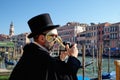 Venice, Italy - February 10, 2018: Man in a mask taking pictures during the Carnival Royalty Free Stock Photo
