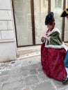 masquerading woman on street in Venice city Royalty Free Stock Photo