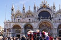 Venice, Italy Saint Mark square with crowd during carnival. Basilica di San Marco facade with people at Piazza Royalty Free Stock Photo