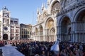 Venice, Italy Saint Mark square with crowd during carnival. Basilica di San Marco facade with people at Piazza Royalty Free Stock Photo