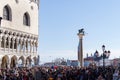 Venice, Italy Saint Mark square with crowd before Doges Palace during carnival. Palazzo Ducale corner viewed Royalty Free Stock Photo