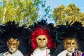 Spectacular Venetian carnival masks displayed for sale on vendor stand Italy