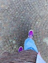 top view of feet of tourist in Vans sneakers