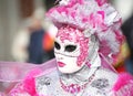 Venice, Italy - February 5, 2018: woman in costume with pink mas Royalty Free Stock Photo