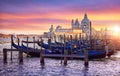 Venice Italy. Gondolas floqting by the docks Grand Canal Royalty Free Stock Photo