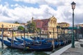 Venice, Italy. Gondolas moored on the Grand Canal and Church of Scalzi