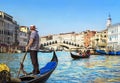 Venice, Italy. Gondolier with rowing oar in his gondola on Grand Royalty Free Stock Photo