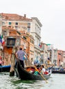 Venice, Italy - July 25, 2016: Gondola at Rialto Bridge on March 28, 2012 in Venice, Italy. There were several thousand gondolas i