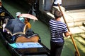 VENICE, ITALY - JULY 12 : Gondolier plying his trade in Venice Italy