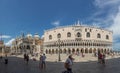 People visit San Marco square with San Marco cathedral and Doges Palace in Venice, Italy Royalty Free Stock Photo