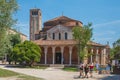 People walking past Church of Santa Fosca on island of Torcello in Venice, Italy