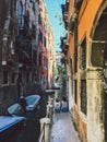 Venice, Italy - July 14th, 2017:Venice cityscape, narrow water canal, bridge and traditional buildings. Italy