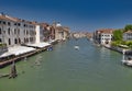 Venice, Italy - July 1, 2017: A view of the colorful Venetian houses, Gondolas and boats in the grand canal in Venice Royalty Free Stock Photo