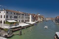 Venice, Italy - July 1, 2017: A view of the colorful Venetian houses, Gondolas and boats in the grand canal in Venice Royalty Free Stock Photo