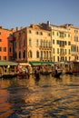 Venice, Italy - 30 June 2018: The gondolas parked along the grand canal in Venice, Italy Royalty Free Stock Photo