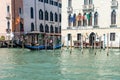 Venice, Italy - 30 June 2018: the gondolas parked along the grand canal in Venice, Italy Royalty Free Stock Photo