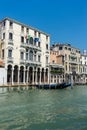 Venice, Italy - 30 June 2018: the gondolas parked along the grand canal in Venice, Italy Royalty Free Stock Photo