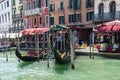 Venice, Italy - 30 June 2018: the gondolas parked along the grand canal in Venice, Italy Royalty Free Stock Photo