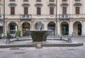 Venice, Italy - June 30 2017: Historic buildings in Venice. A view of the colorful Venetian building, with a fountain in