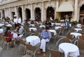 Venice, Italy - June 07, 2017: People in cafe on San Marco square in Venice. Royalty Free Stock Photo