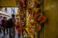 VENICE, ITALY - JUNE 18, 2015: Red and gold beautiful mask in a souvenir shop in Venice, selective focus. Turists