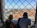 Two tourists admiring the view from the top of St Marks Campanile in St Marks Square of the incredible Venice, Italy Royalty Free Stock Photo