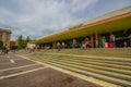 VENICE, ITALY - JUNE 18, 2015: Tourists and passengers waitting outside of Venice airport, crowded airport in summer