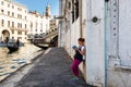 View of gondola and Ponte di Rialto, Campanile of church San Bartolomeo Royalty Free Stock Photo