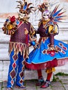 Venice, Italy - March 1, 2019 A couple is dressed with an Arlequin costume