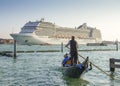 Gondola and cruise ship on a Venetian canal