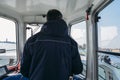 Captain of Venice`s ACTV vaporetto at the helm of the boat