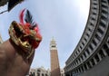 Venice Italy and a mask in Saint Mark square Royalty Free Stock Photo