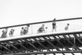 Black and white street photography in Venice. Tourists walking on Constitution Bridge (Ponte della