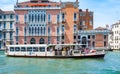 Crowded public venetian public waterbus called vaporetto (ACTV) on Grand Canal in Venice