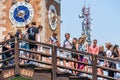 Crowds of tourists crossing the Ponte de l Arsenal o del Paradiso bridge near the main gate of the