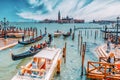 VENICE, ITALY - MAY 12, 2017 : Embankment of the Grand Canal with Gondolas and Gondoliers. Italy Royalty Free Stock Photo