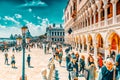 VENICE, ITALY - MAY 12, 2017 : Embankment of the Grand Canal with tourist near  Doge`s Palace and S.Marco square , Italy Royalty Free Stock Photo