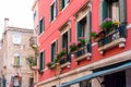 VENICE, ITALY - MAY, 2017: Flower boxes below a window in Venice, Italy Royalty Free Stock Photo