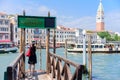 VENICE, ITALY - MAY, 2017: girl tourist standing on the pier in the background of the panorama of Venice Royalty Free Stock Photo