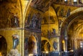 Golden wall mosaic inside San Marco or St Mark`s Basilica, it is old landmark of Venice. Interior of famous St Mark`s cathedral