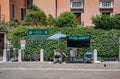 Gondolier in Venice awaiting tourists to sell them gondola rides Royalty Free Stock Photo