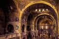 Inside the old St Mark`s Basilica or San Marco, it is top landmark of Venice. Golden mosaic interior of ornate Saint Mark`s Royalty Free Stock Photo