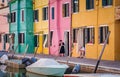 Morning traditional picturesque scene from Burano, Italy. Senior locals in the colorful Burano island