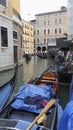 VENICE, ITALY - MAY 31, 2016: Narrow Canals with gondolas traffic Gondolas is a traditional, flat-bottomed Venetian rowing boat,