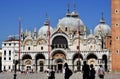 VENICE, ITALY - MAY 11, 2021: people walking near saint mark bell tower and palace of Doge in Venice, Italy Royalty Free Stock Photo