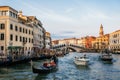 Rialto Bridge on Grand Canal with gondolas and boats, Venice, Italy Royalty Free Stock Photo