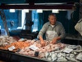 Venice, Italy - 22 May 2105: Rialto fish markets. Fishmonger at